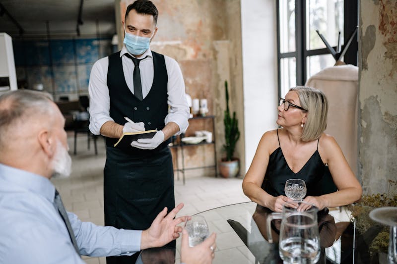 Wing Snob franchise team serving customers